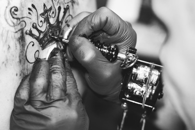 master tattoo woman on her back