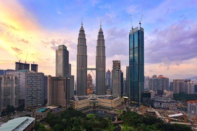 beautiful scenery of kuala lumpur cityscape with colorful sunset background.