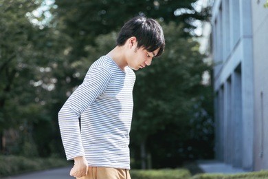 young man looking down