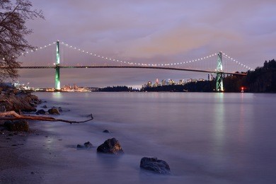 lions gate bridge and downtown vancouver after sunset