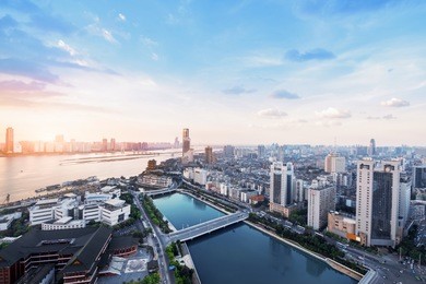 suspension bridge and modern residential district near haihe river in tianjin in blue cloud sky