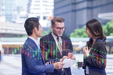 double exposure group of multicultural people of creative use of technology with graph money stock market trading background, sharing smartphones, creating an online lifestyle.communications concept.
