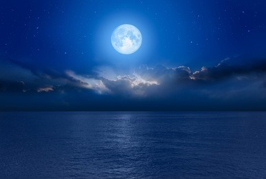 night sky with blue moon in the clouds "elements of this image furnished by nasa