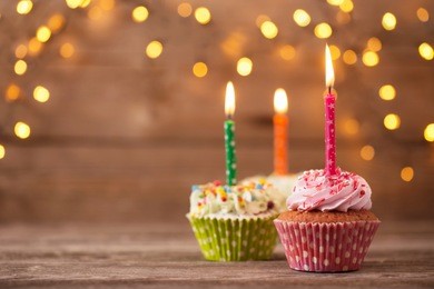cupcakes on dark old wooden background