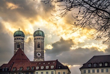 frauenkirche - cathedral of our dear lady in munich with sunset in the background, germany