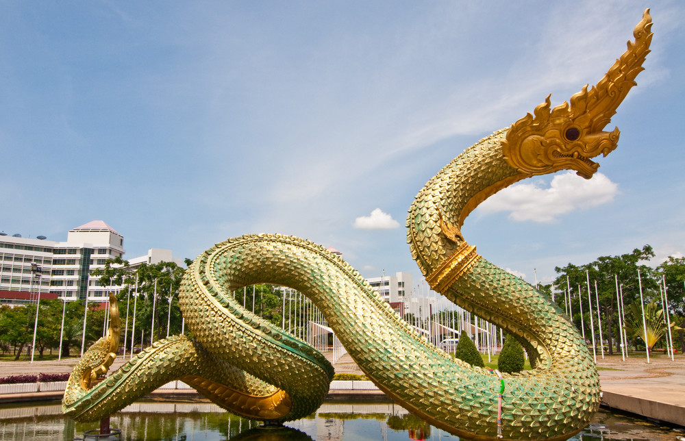 big naga statue on the pond, thailand.