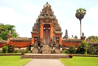 main entrance of taman ayun temple in mengwi (bali, indonesia) on a beautiful sunny day. originally dated from 1634