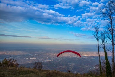red paraglider landscape
