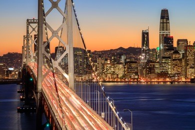 san francisco bay bridge and skyline at dusk. yerba buena island, san francisco, california, usa.