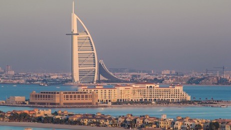dubai skyline with villas nad burj al arab during sunset timelapse.  top view from atlantis on palm jumeirah. 