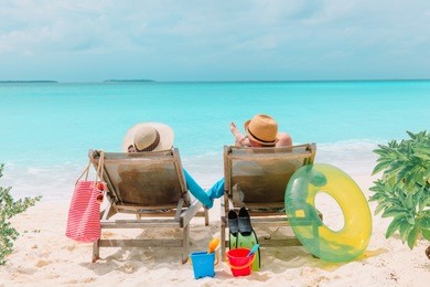 happy couple relax on a tropical beach