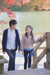 japanese couple standing in park