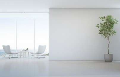 indoor plant on white floor with empty concrete wall background, lounge and coffee table near glass window in sea view living room of modern luxury beach house or hotel - home interior 3d illustration