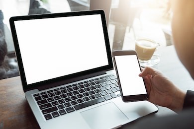 close up of man using mobile smart phone,sending massages on the garden.having sunbath.phone with black screen,texting,video calls,