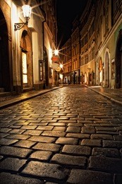 mysterious narrow alley with lanterns in prague at night