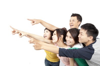 happy asian young group pointing away isolated on white background