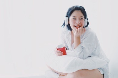 young asian beautiful woman relax with music and drink coffee on white background lifestyle concept