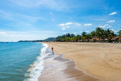 nha trang - vietnam. december 13, 2015. forming a magnificent sweeping arc, nha trang's 6km-long golden-sand beach is the city's trump card.
