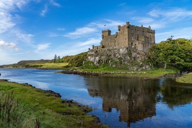 dunvegan castle and harbour on the island of skye, scotland