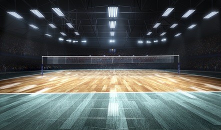 empty professional volleyball court in lights