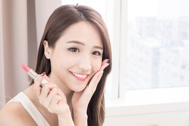 beauty skincare woman take lipstick in the home