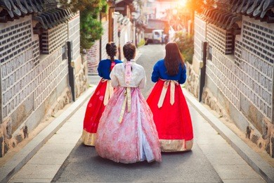 korean lady in hanbok or korea gress and walk in an ancient town in seoul, seoul city, south korea.