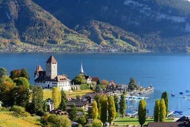 view of lake thun in switzerland during autumn season from spiez train station