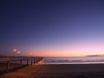 new brighton pier wharf jetty sea ocean beach morning sunrise lights christchurch new zealand
