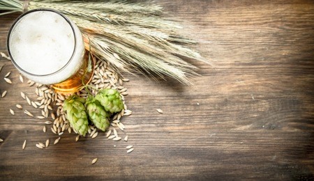 glass of natural beer. on a wooden table.