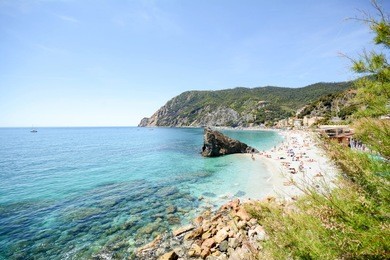 cinque terre: view to monterosso al mare beach from the vernazza hiking trail in early summer, liguria italy europe