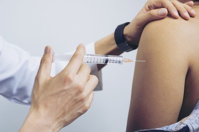 selective focus,doctor inject vaccine to patient.