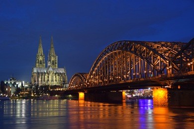 cologne cathedral and hohenzollern bridge at night