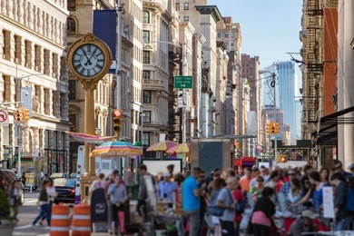 crowds of people shopping at street vendors along the sidewalks of fifth avenue in manhattan, new york city nyc