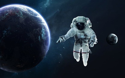 astronaut and earth planet. science fiction wallpaper. elements of this image furnished by nasa