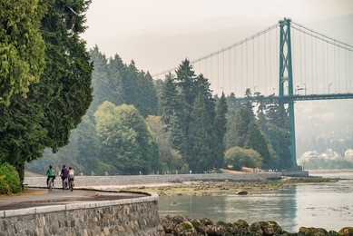 biking along stanley park in vancouver, canada.