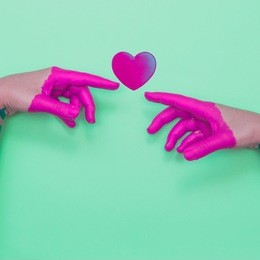 two painted hands touch the heart by fingers.  contemporary art collage.