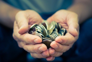 coins in hands. saving money concept.