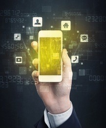 caucasian hand in business suit holding a smartphone with golden-yellow holographic screen