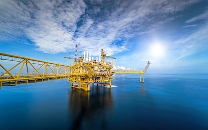 large offshore oil rig drilling platform at sunset and beautiful sky in the gulf of thailand