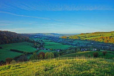 an early morning panorama view of the stroud valley in autumn from swifts hill nature reserve, sssi near slad, the cotswolds, gloucestershire, england, uk