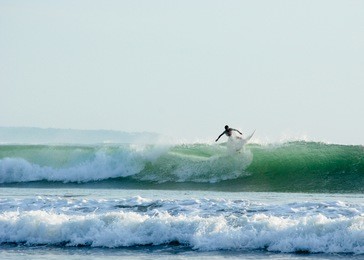 surfing in bali, kuta beach, indonesia
