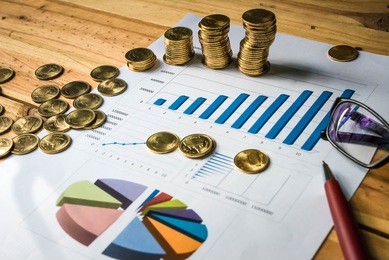 personal financial planning concept. businessman workplace with papers for financial planning. business people discussing the charts and graphs showing the results of successful financial planning.