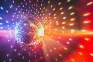 disco ball with bright rays, night party background photo