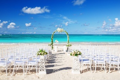 romantic wedding setting on the beach and blue sky background
