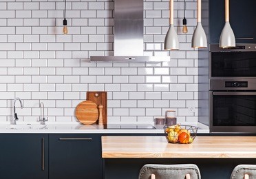 modern interior. spacious  kitchen  with white brick tile wall.