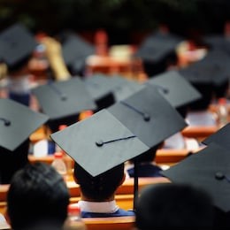 shot of graduation caps during commencement.
