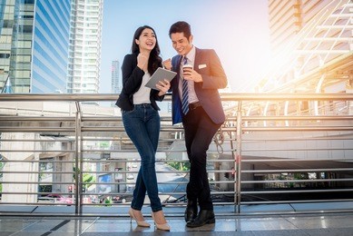 asian young businesswoman explaining report to her boss at meeting outdoor