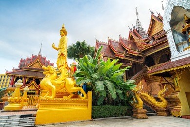 figure of buddha and buddhist palace in xishuangbanna,china