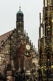 facade of frauenkirche church of our lady is a catholic church and schoner brunnen fountain in hauptmarkt market in nuremberg, germany. gothic architecture in bavaria.