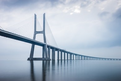vasco da gama bridge at sunrise in lisbon, portugal